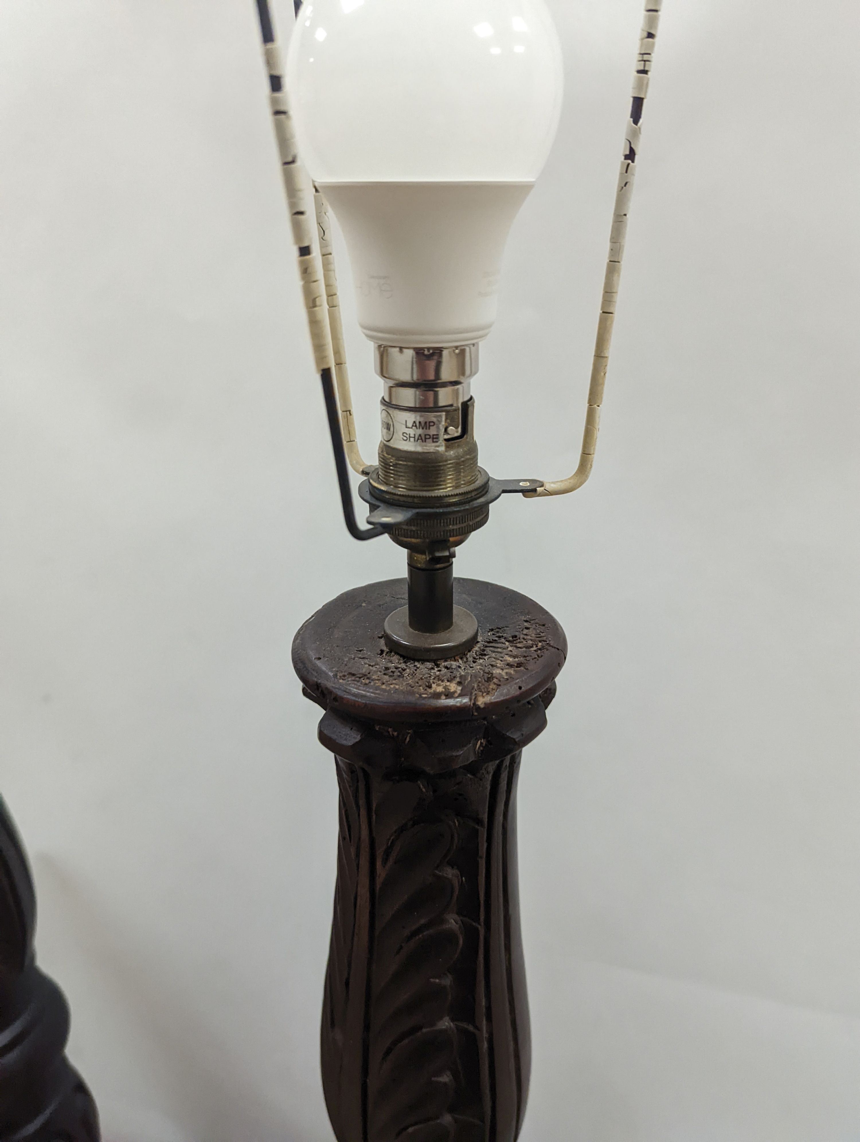 A pair of turned wood lamp bases, height 69cm excl. fitting